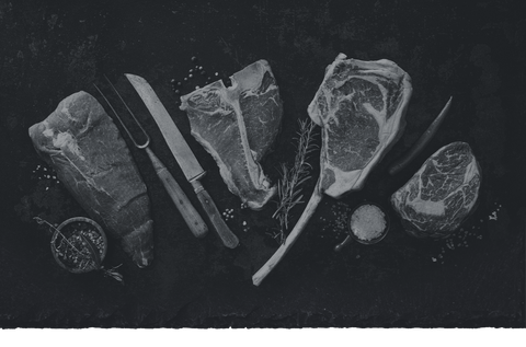 Beresford's steaks and knives glamour shot on slate table